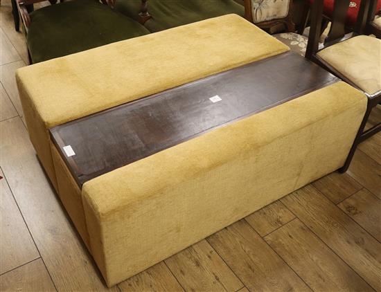 A large box seat ottoman